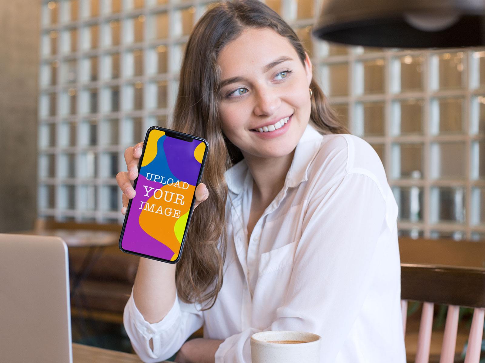 iPhone Free Mockup in Hand of a Smiling Girl | The Free Mockup